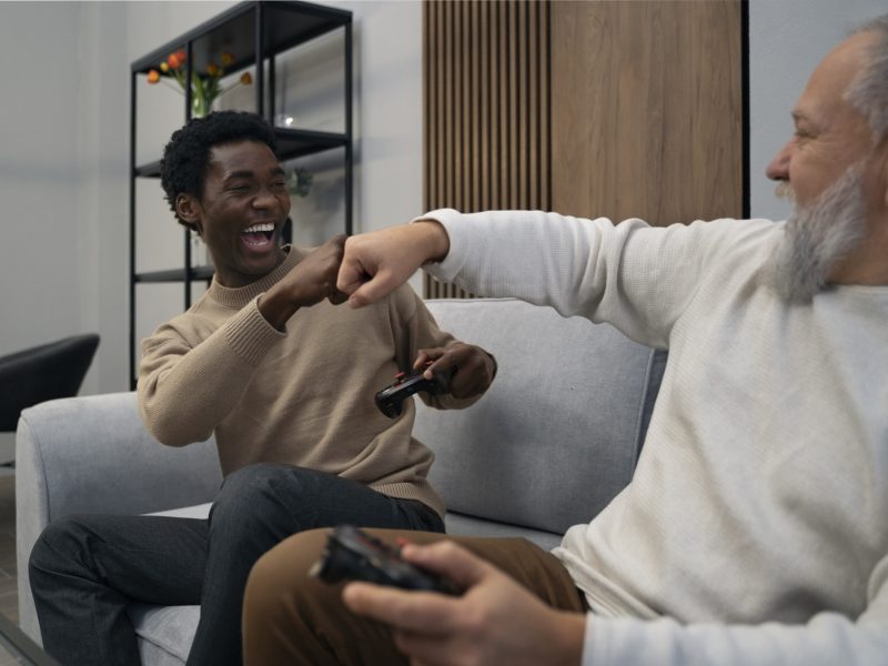 side-view-men-playing-videogame
